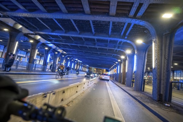 Cycling in the city, in the dark, in the evening, cycling underpass at the main train station, in