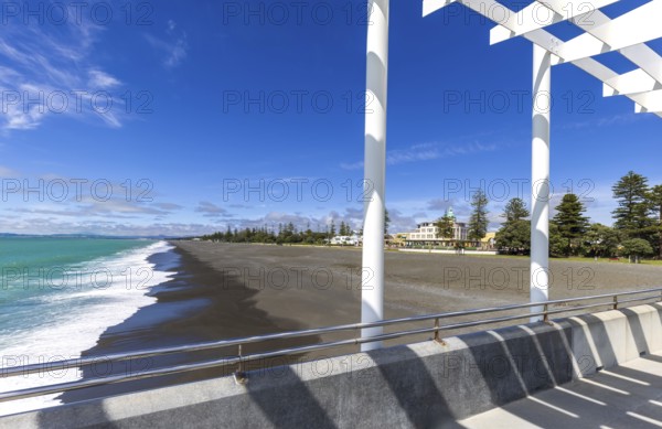 Overlooking the sandy shore of Hawke Bay, this image captures Napier's distinctive art deco