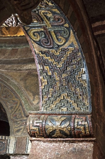 Arched vault with the seal of Lalibela carved in stone and coloured geometric ornaments, monolithic