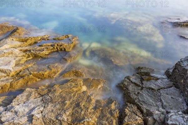 Crystal clear and turquoise water on the beach of Ustrine Bay on a sunny day on the island of Cres,