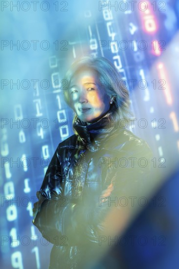 An elderly Asian woman stands confidently in the metaverse, surrounded by virtual elements and
