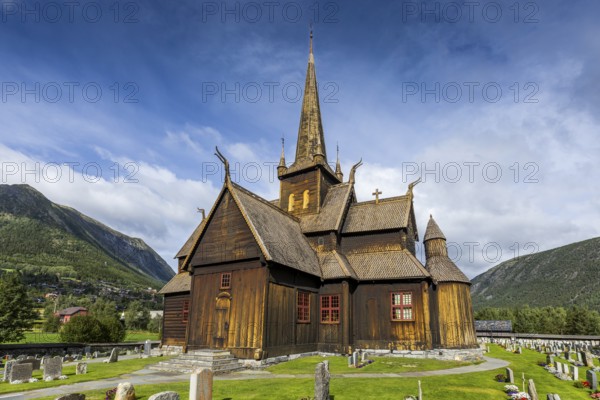 Lom Stave Church (Lom stavkyrkje) with cemetery in the foreground, Lom, Norway