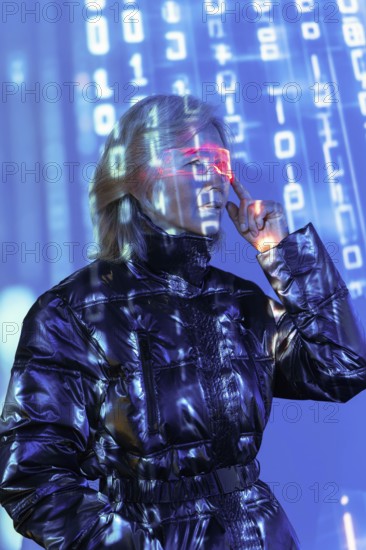 An elderly Asian woman engages with the metaverse, wearing futuristic glasses. Digital numbers