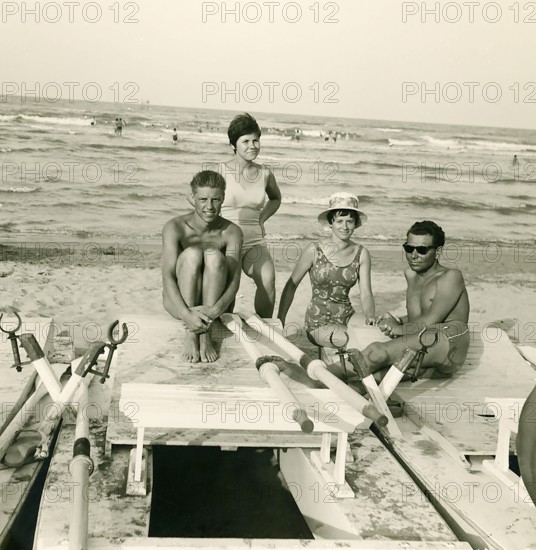 Historical photo summer 1961, tourists, beach, Rimini, Italy