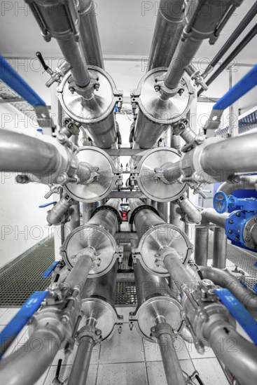 Symmetrical arrangement of metal pipes and valves in an industrial environment, ENCW Netze Calw