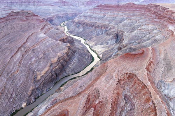 Captivating aerial photograph showcasing the sinuous Rio San Juan cutting through the rugged red