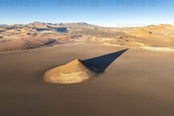 From above, the Cono de Arita in Salta, Argentina forms a striking natural landmark amidst the