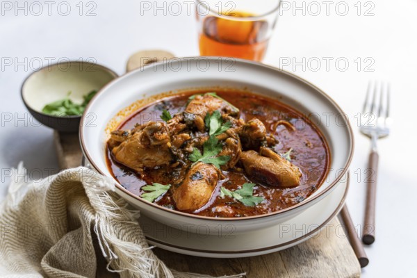 A flavorful bowl of traditional Georgian chakhokhbili chicken stew made with tender chicken pieces