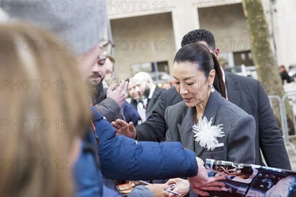 Michelle Yeoh signs autographs ahead of the premiere of the film Everything Everywhere All At Once
