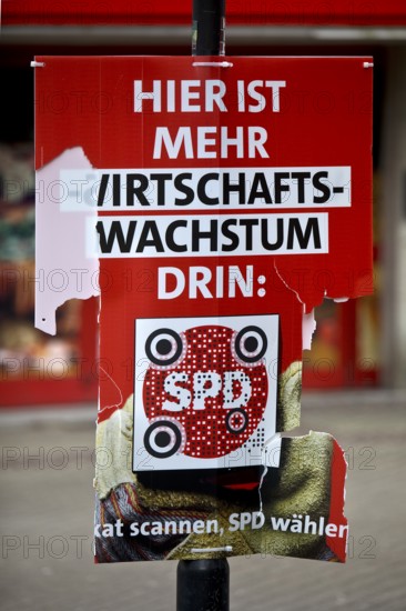 Destroyed SPD election poster in the pedestrian zone of Wattenscheid, Bochum, Ruhr area, North