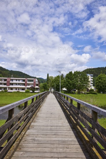River Kinzig, pedestrian bridge, wooden bridge, hilly landscape with coniferous forest, residential