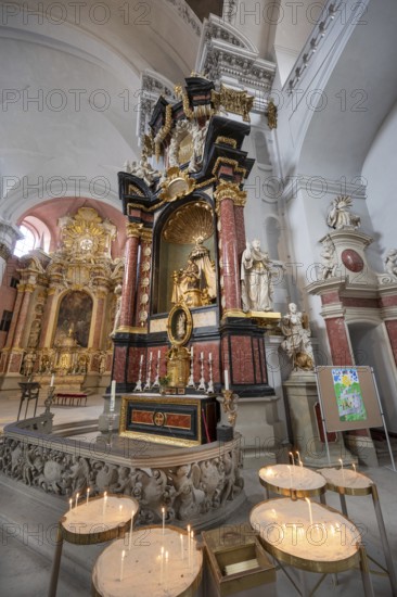 Sacrificial candles on the side altar in the baroque church of St Martin, Grüner Markt, Bamberg,