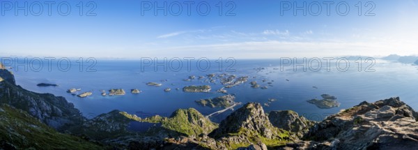 Panorama, view of the sea with numerous small rocky islands with houses, at the summit of