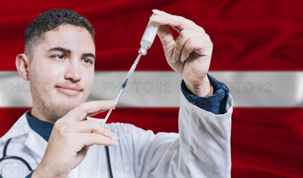 Doctor holding syringe on Latvia flag background. Medical professional holding syringe with Latvian