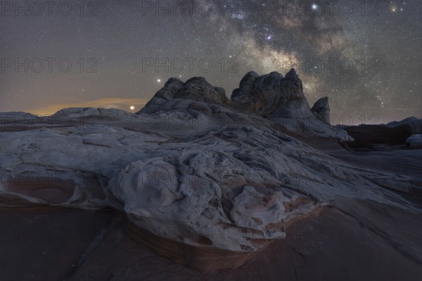 A breathtaking view of Utah's desert landscape under a star-studded Milky Way. No people in this