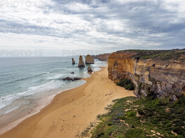 Breathtaking coastal scene featuring towering cliffs and striking sea stacks in the Twelve