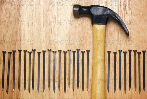 Hammer and Nails Abstract on Wood Background