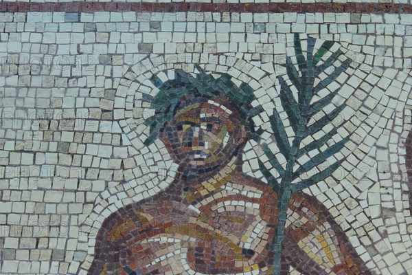 Mosaic depiction of a figure with palm tree, consisting of colorful stones, Museum of the History