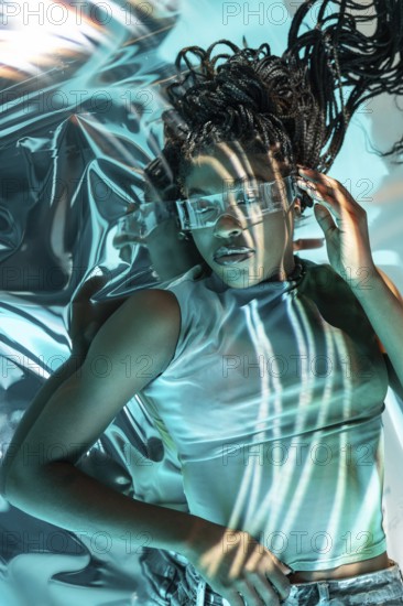 A futuristic young African woman wearing high-tech glasses, immersed in a vibrant and digital