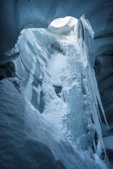 A stunning beauty of an ice cave within Katla Glacier, Iceland, captured in winter. The icy