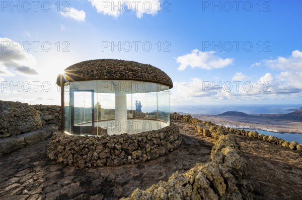 Stairway and viewing platform at the Mirador del Río viewpoint, in the evening light with sun