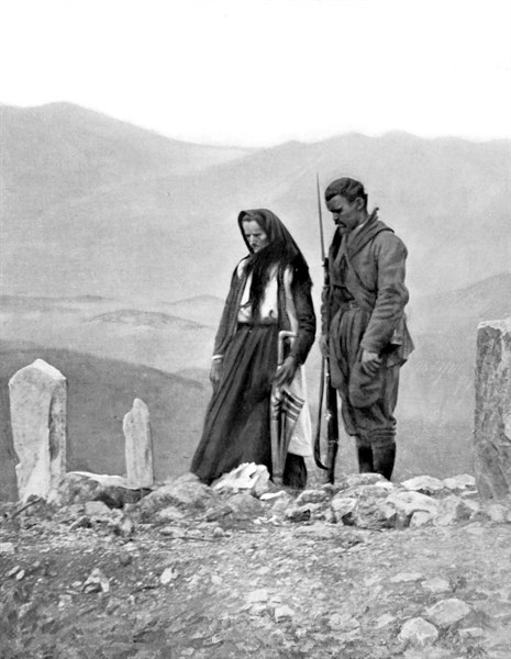 Before the withdrawal from Scutari, a Montenegro mother and her son at the grave of the father, killed in the assault of the Bardaniol heights (1913)