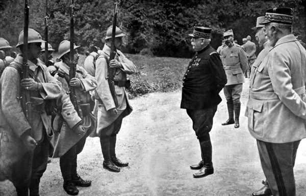 World War I. On the eve of the Champagne offensive, General Joffre inspects the soldiers wearing the new helmet (1915)