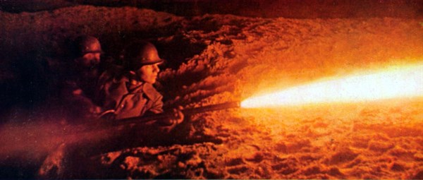 World War II. German soldiers attacking a concrete shelter at night with a flame-thrower (1941)