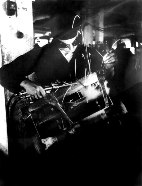 Female worker in a lamination factory