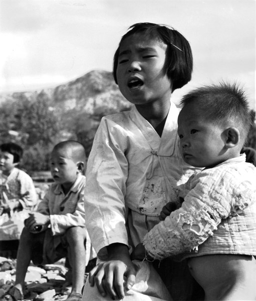 Korean war, young schoolgirl from Evur Pyung village, where school was completely razed to the ground during the war. 1950