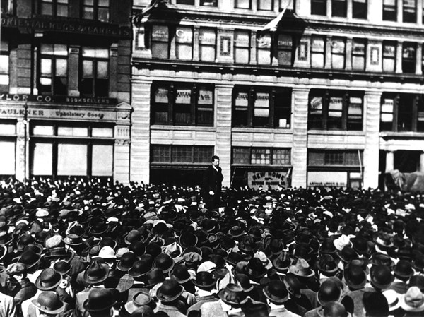 In New York, Carlo Tresca is delivering a speech during a meeting of industry workers at Union Square