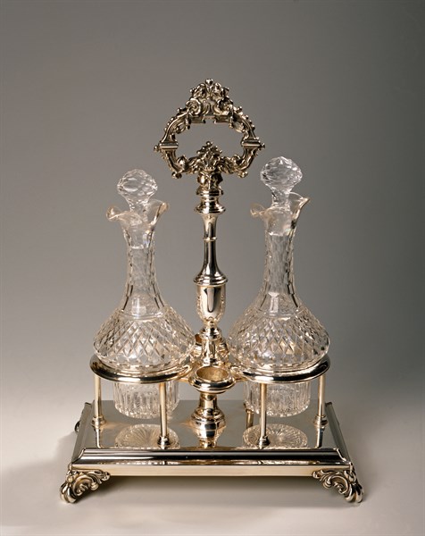 Two bottles and silver metal structure.
