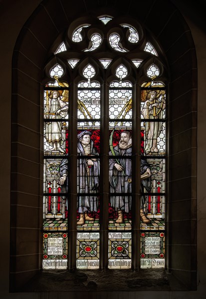 Martin Luther and Martin Rinckart. Stained glass window of the church of Sainte-Anne in Eisleben
