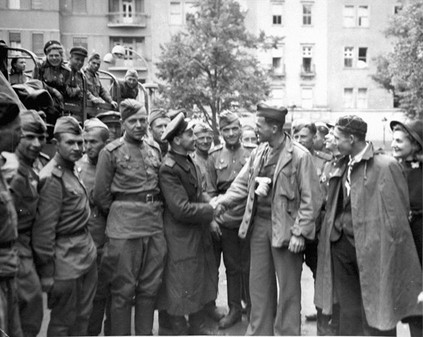 U.S sergeant receives a Russian welcome in Berlin, Germany (July 2,1945)