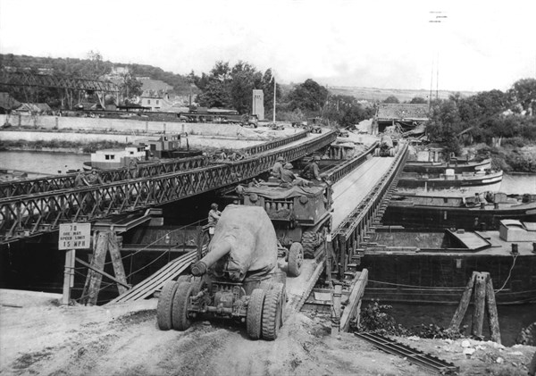 US 155 mm. gun across a Bailey Bridge over the Seine river in France (Summer 1944)