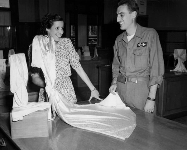 An American soldier gets something for his wife in Marseilles, August 25, 1945