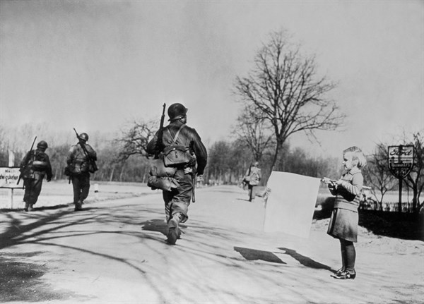 German girl holds a surrender flag near Neuhofen, March 1945