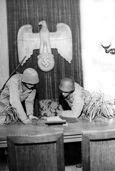 American soldiers inspect Nazi official's desk in Hardt (Germany) March 1, 1945