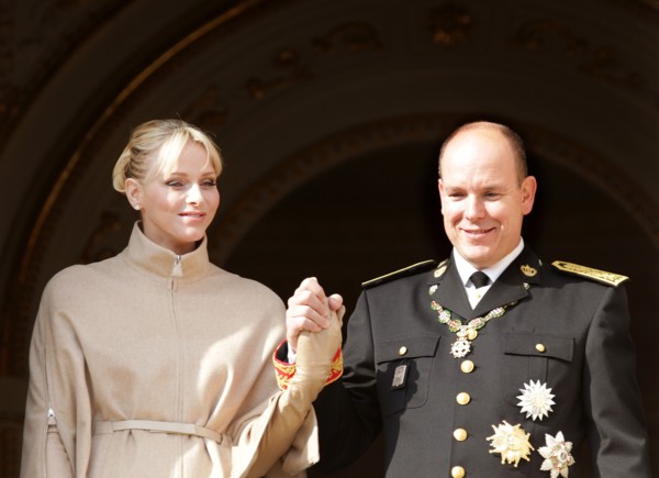Prince Albert II of Monaco and his wife Princess Charlene greet from the balcony of the palace of