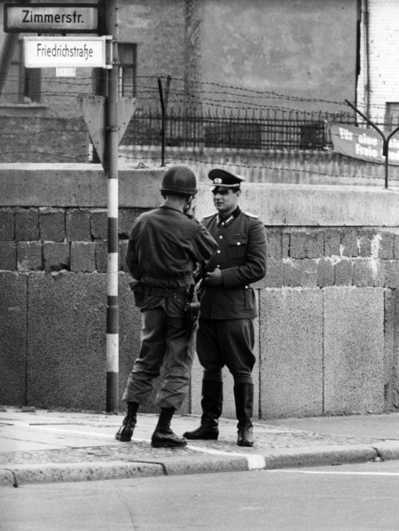 US soldier and People's Police officer standing face to face