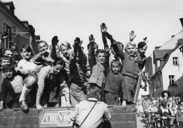 The Nazi propaganda picture shows Sudeten German children doing the Nazi salute in As, Czech