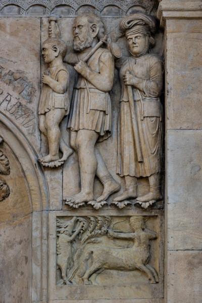 Fidenza, cathedral (Cathedral of San Donnino), facade, panel: a centaur strikes a deer and above