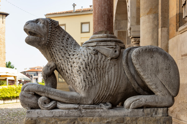 Fidenza, Duomo (St. Donnino Cathedral), the façade, the prothyrum: left column-bearing lion