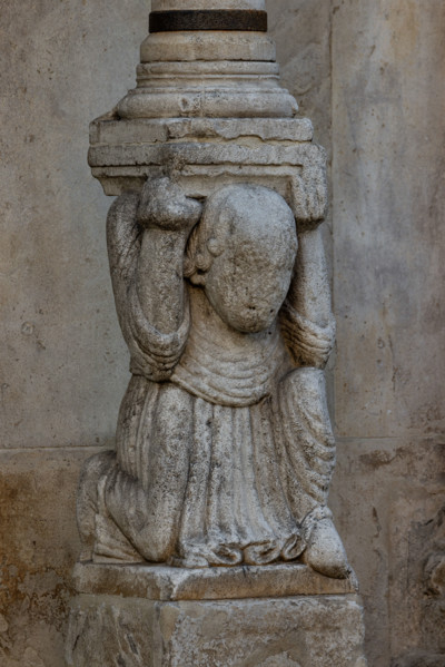 Fidenza, Duomo (St. Donnino Cathedral), facade, left portal: the right telamon supporting the