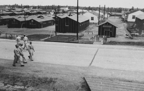 Group of Soldiers Walking Near Military Barracks, WWII, 2nd Battalion, 389th Infantry, US Army Military Base Indiana, USA, 1942