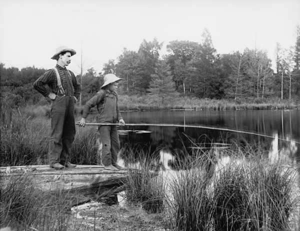 Man and Boy Fishing in Lake, USA, Detroit Publishing Company, 1915