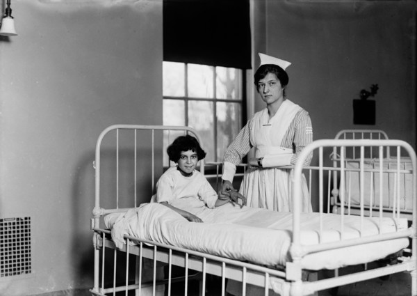 Nurse Checking Child's Pulse in Hospital, Portrait, Harris & Ewing, 1915