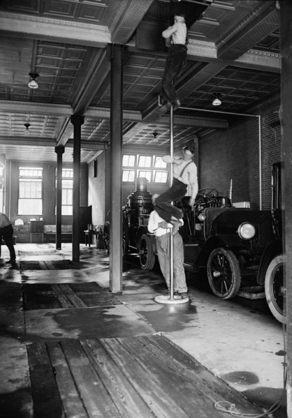 Firemen Sliding down Pole in Firehouse, USA, Harris & Ewing, 1922