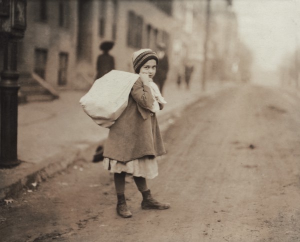 Young Girl Carrying Sack of Hosiery Supporters Home after Leaving Work and Before she Goes off to School, Worcester, Massachusetts, USA, Lewis Hine, 1912