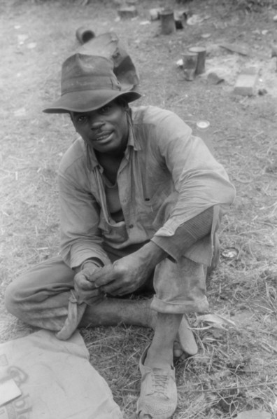 Florida Migratory Agricultural Worker Playing Cards during Lunch hour at Grading Station, Belcross, North Carolina, USA, Jack Delano for Farm Security Administration, July 1940